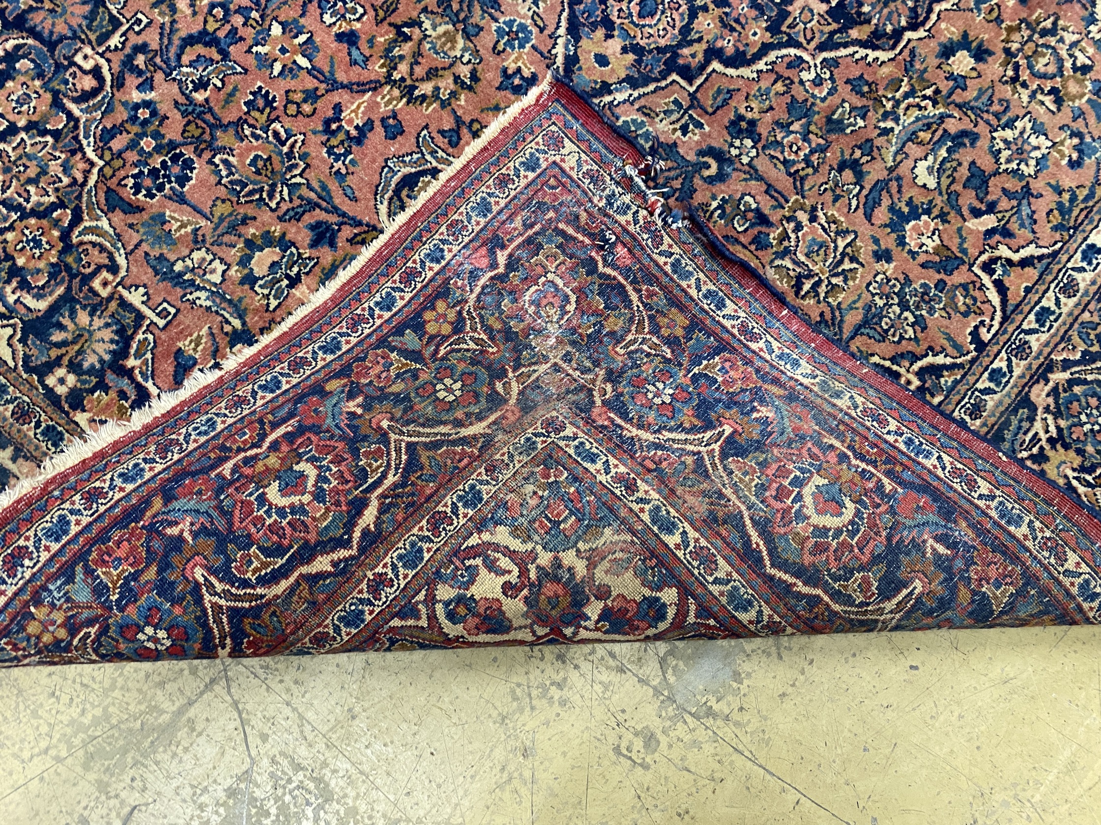 An Isphahan red ground rug, 206 x 133cm together with a Bokhara red ground runner